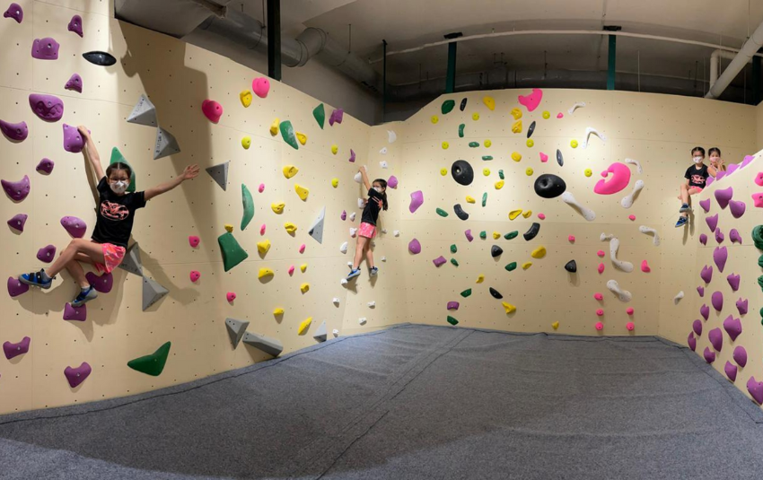 Children trying bouldering at Boulder Planet