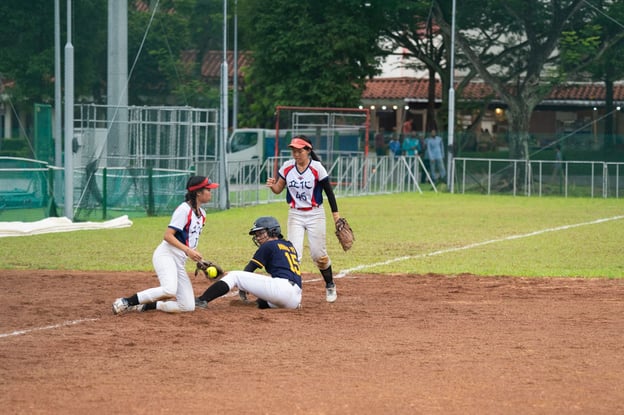 ACJC’s Ning Yo slid into third base