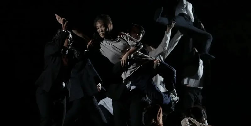 Girl in dance group being lifted up
