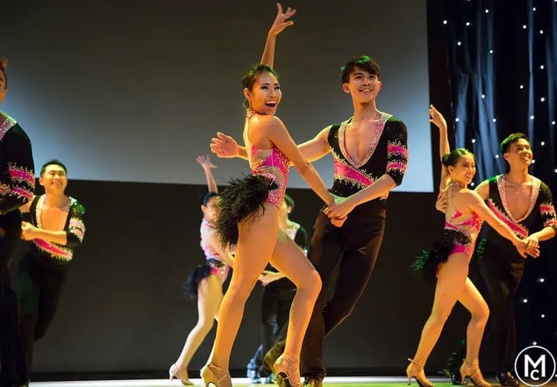 Couples dancing Salsa on stage