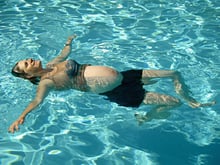How is swimming beneficial for pregnant women?