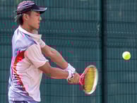 How do you execute a tennis backhand?