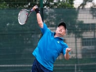 How do you execute a tennis overhead?