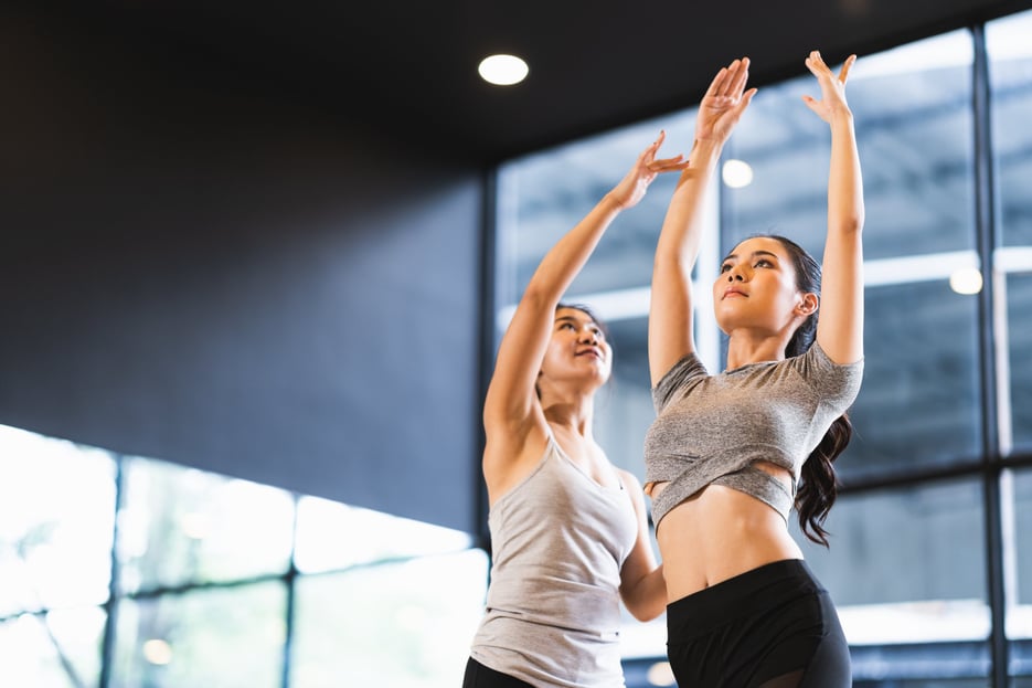 Dance instructor teaching student in class