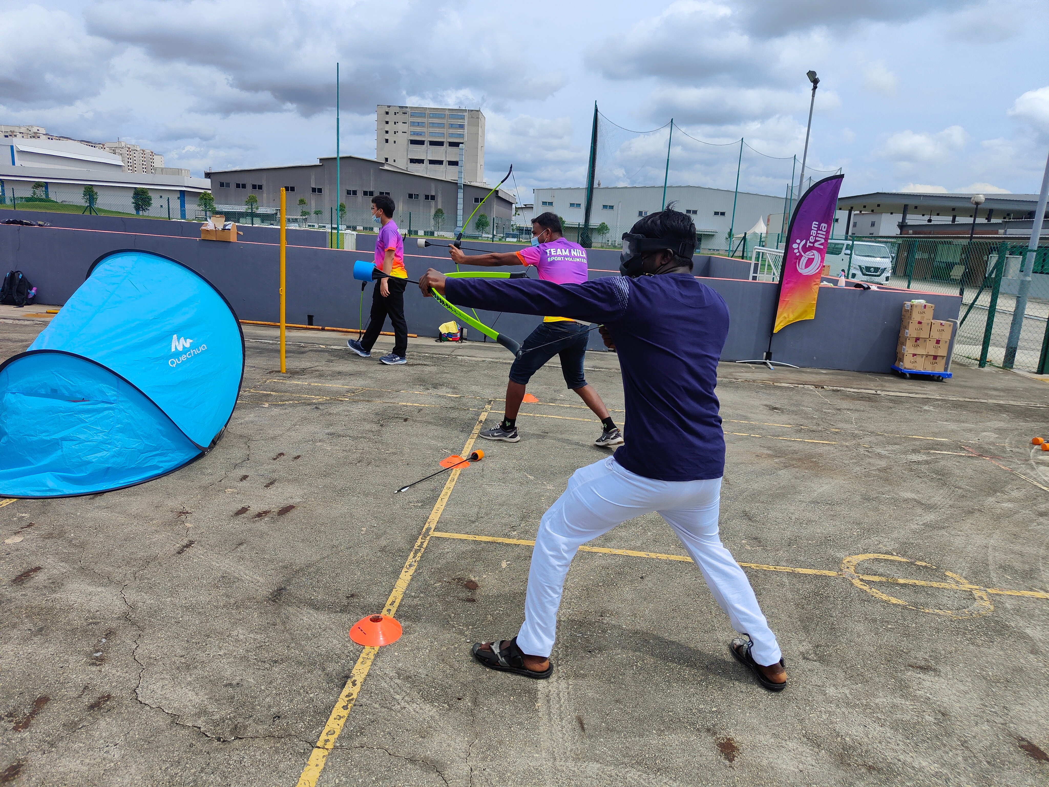 Enjoying a game of archery at the Archery Tag activity station