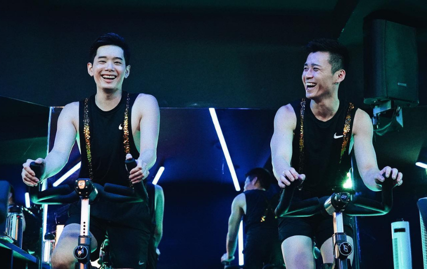 Men doing indoor cycling at Revel Cycle