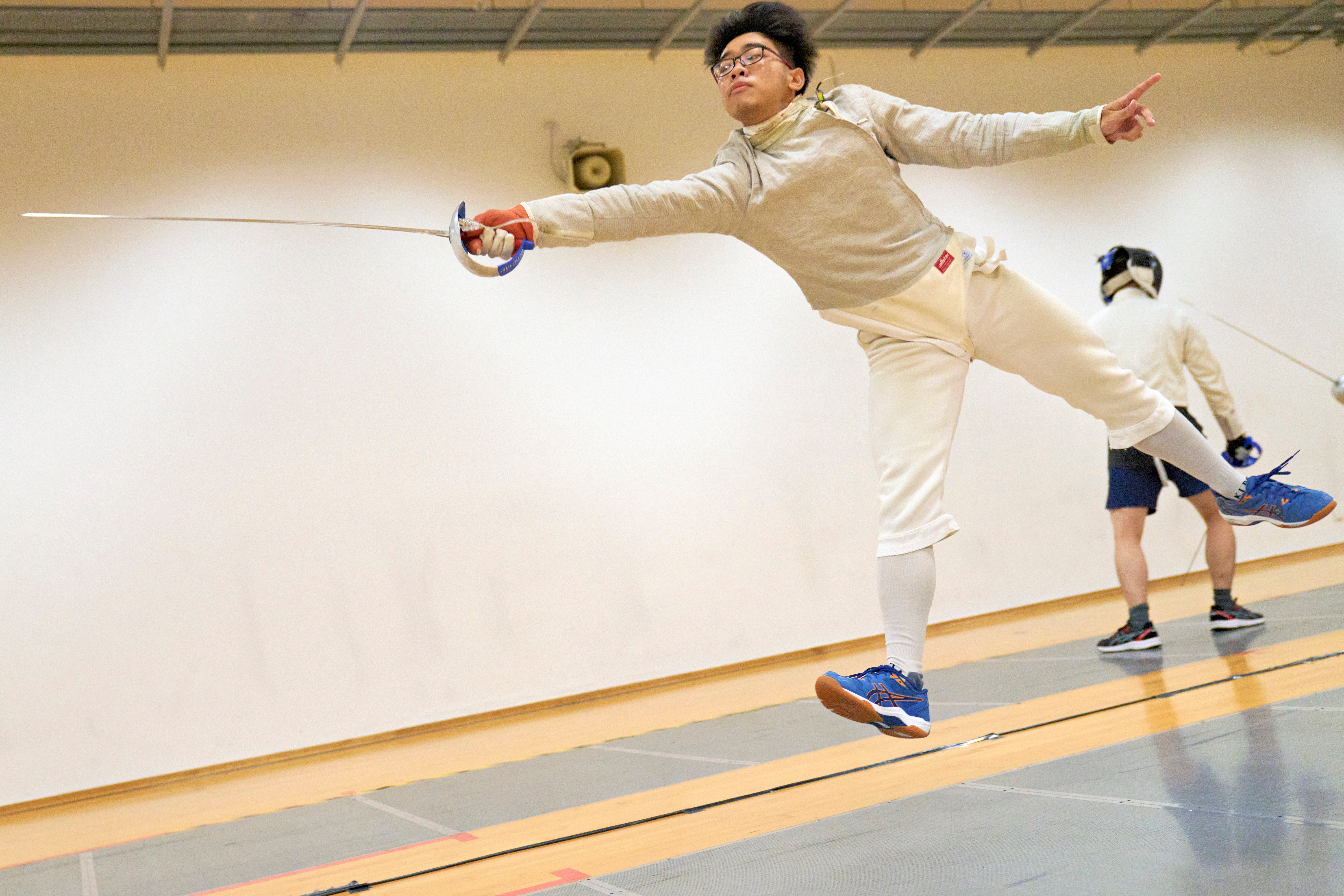 2023_04_20 Fencing Sabre A Div Boys Photo by Eric Koh, Fencer warms up before the match DSC07265