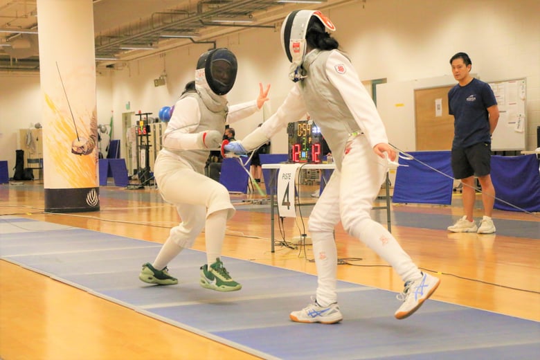 Hwa Chong Institution's Caitlin Lim (Right) was beaten 13-12 by SAJC's Amelia Koh in the round of 16 stage of the Foil event.