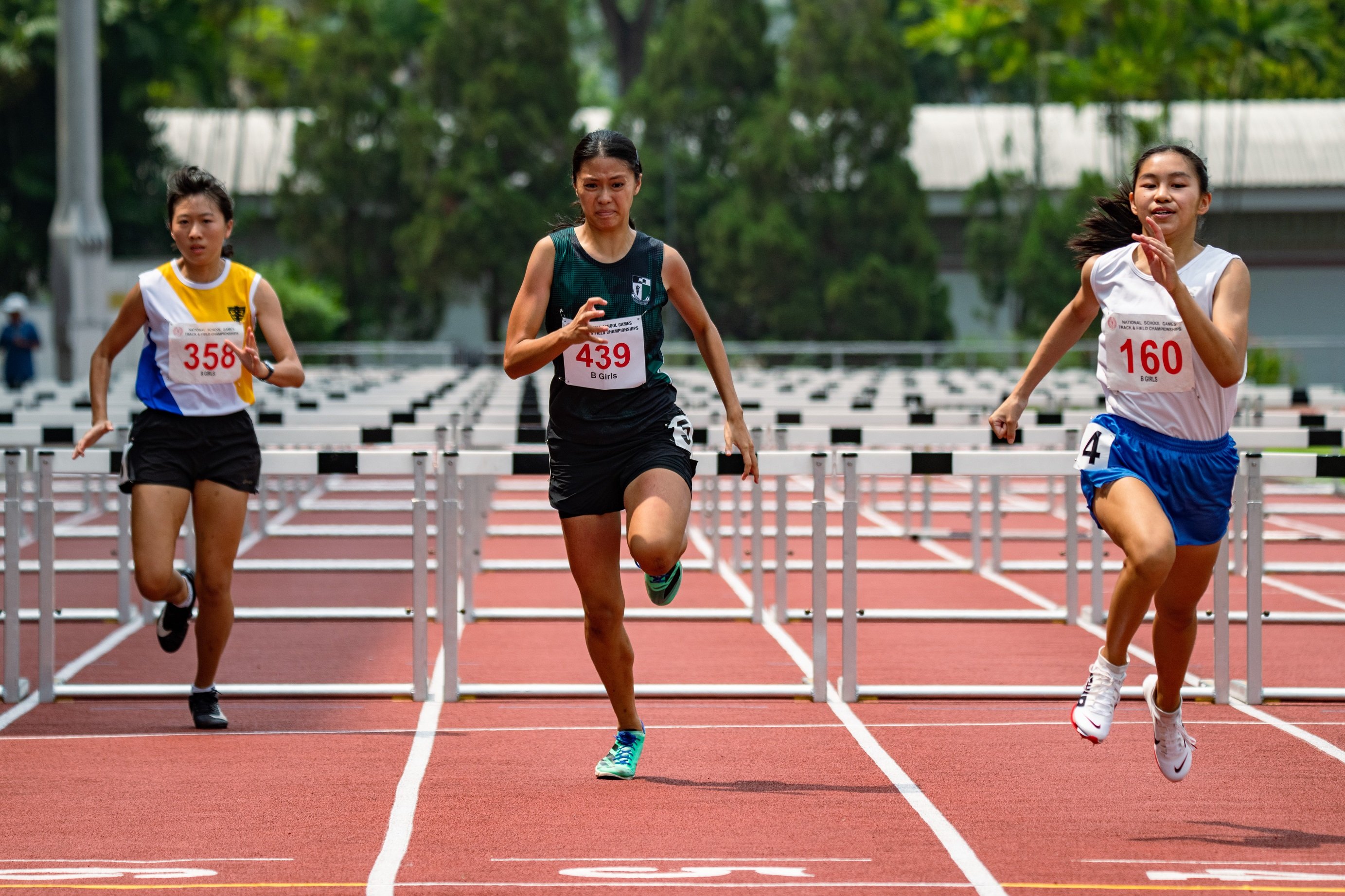 2023-04-14_National School Game T&F 2023 (PM)_Photo by Tom Ng Kok Leong_8509757_B Girls 100m Hurdles Samantha Looi Yan Ning (tag160) of SNG 1st place 15.99s