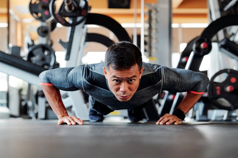 asian-sportsman-doing-push-ups-2021-08-26-19-52-22-utc